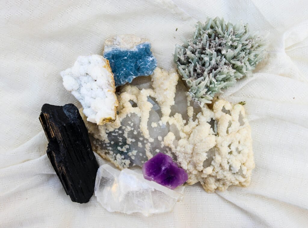 project-4 Diverse mineral specimens including amethyst and quartz on display.