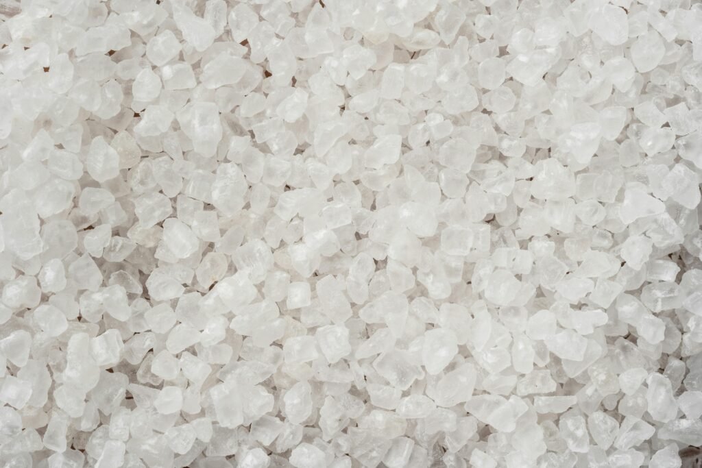 project-1 Detailed image showing coarse white sea salt crystals with a textured surface.